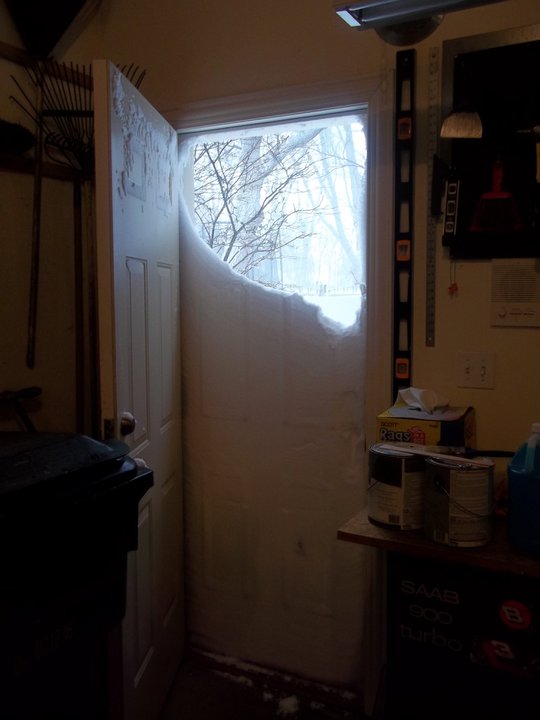 snow filled up to the door